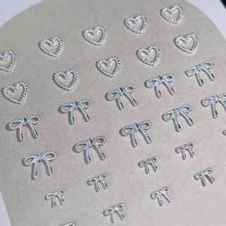 10pcs โลหะผสม Bowknot Love เล็บ Art Charms ตกแต่ง 3D โลหะหรูหรา Silver Bows รูป Jewellery DIY เล็บออกแบบอุปกรณ์
