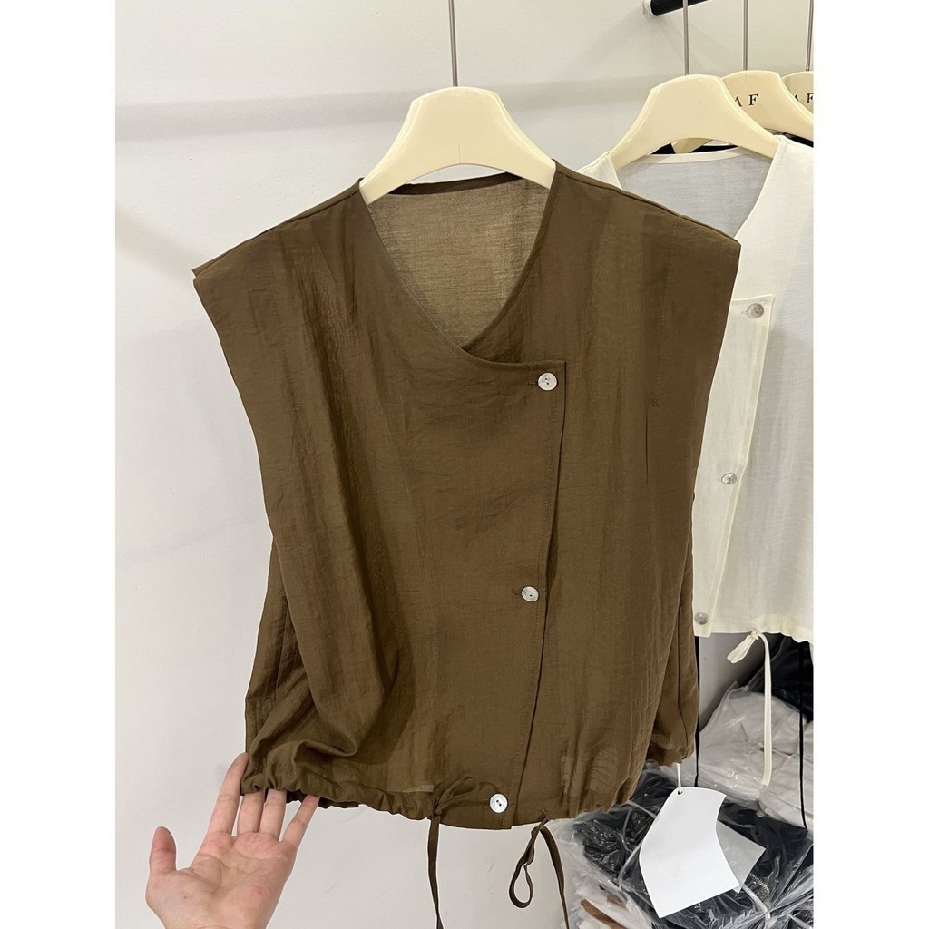 สินค้ายุโรปหลวมslimmerดูแขนกุดสีทึบเสื้อผู้หญิงฤดูร้อนสไตล์ใหม่high-end Hem Drawstringเสื้อNiche Top