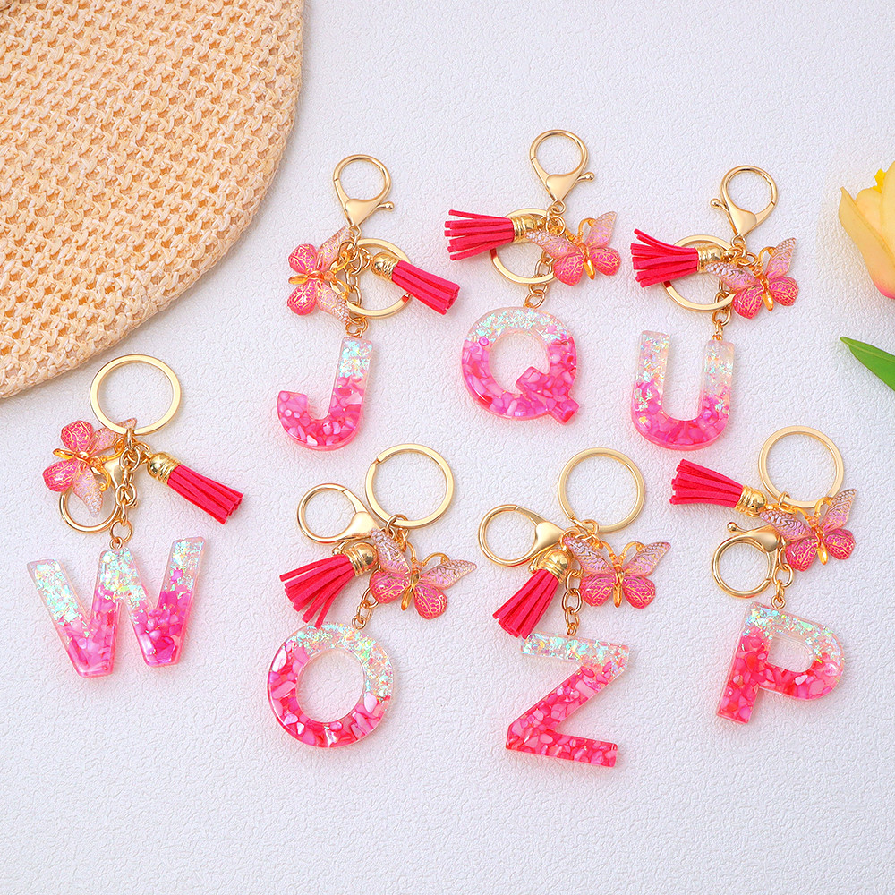 1ชิ้นเลื่อมเรซิ่น26จดหมาย พวงกุญแจสีชมพูพู่ผีเสื้อจี้พวงกุญแจกระเป๋าถือกุญแจรถอุปกรณ์เสริม