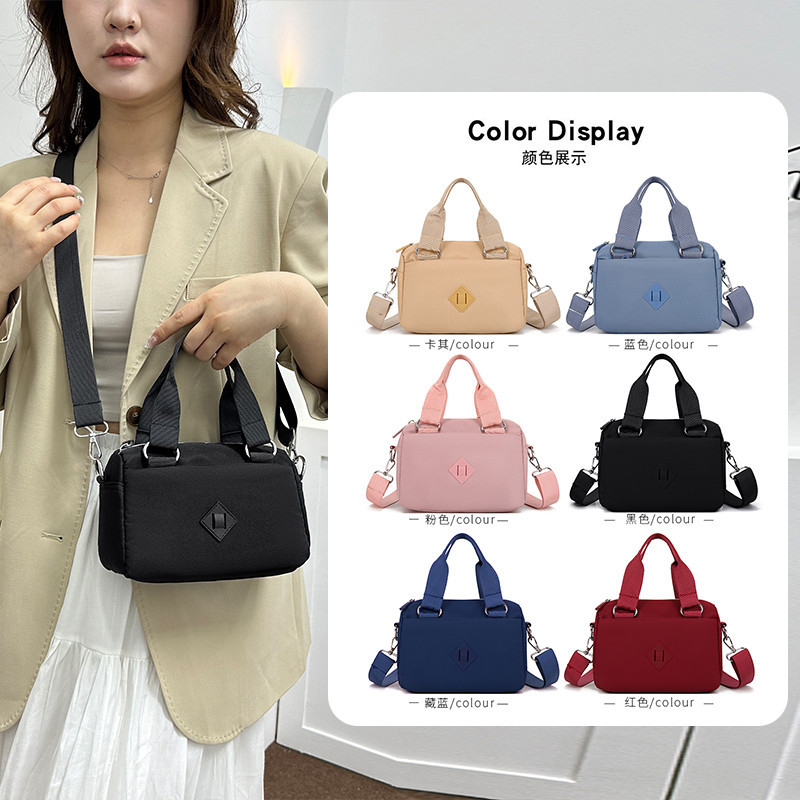 สีทึบสุภาพสตรีที่เรียบง่ายกระเป๋าถือแฟชั่นแนวโน้มทุกการแข่งขันกระเป๋าสะพายหลายชั้นน้ํา-เครื่องไล่ Ny