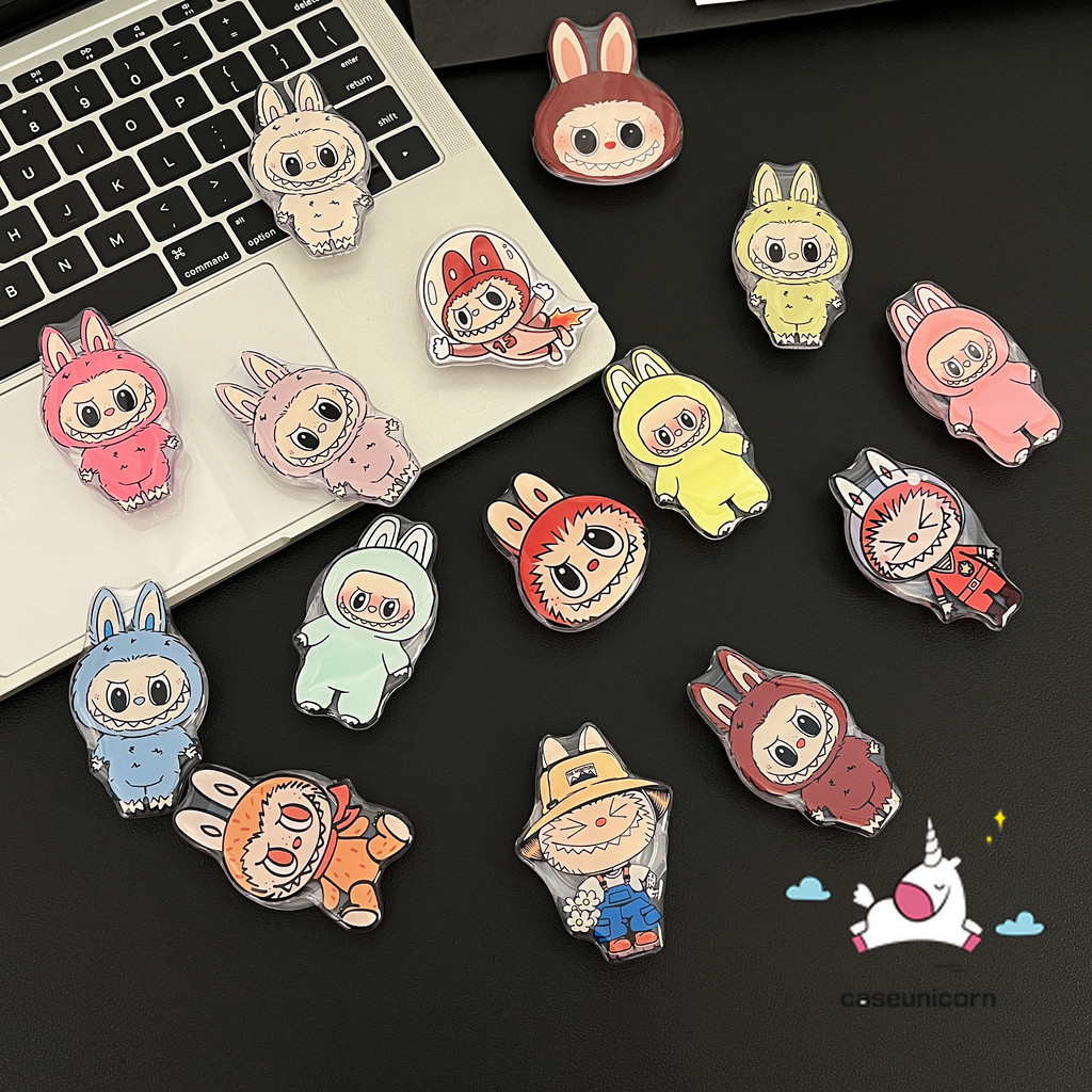 แบรนด์อินเทรนด์การ์ตูนตลก Pop Mart LABUBU ที่วางแหวนแบบพับได้สากลรองรับผีสีม่วงน้อยน่ารักสีสันสดใส LABUBU ที่วางโทรศัพท์ ความคิดสร้างสรรค์ที่วางโทรศัพท์อีพ็อกซี่