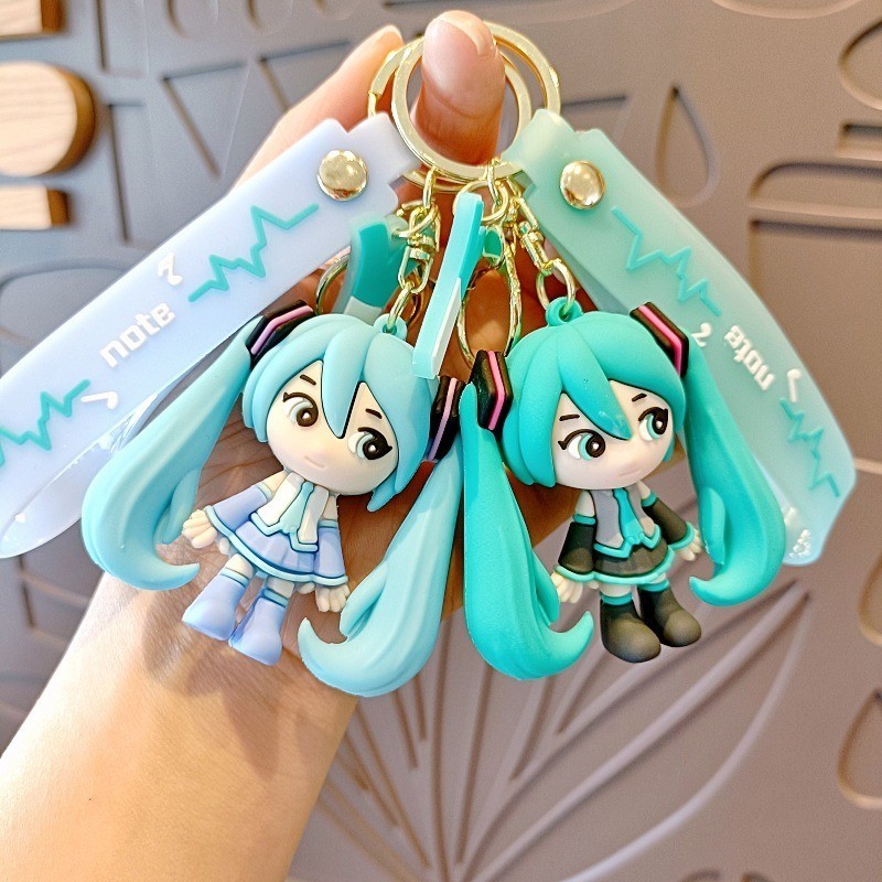 น่ารัก ฮัตสึเนะ มิกุ พวงกุญแจถามรุ่นตุ๊กตาคู่กระเป๋าเป้สะพายหลังแขวนอุปกรณ์แฟชั่นอะนิเมะเครื่องประดับของขวัญสําหรับเพื่อน