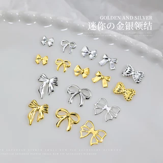 50 ชิ้น เครื่องประดับเล็บโบว์โลหะผสมคนดังทางอินเทอร์เน็ตสีทองสีเงินหรูหราเบาๆผูกโบว์กลวงริบบิ้นตกแต่งเล็บขายส่ง