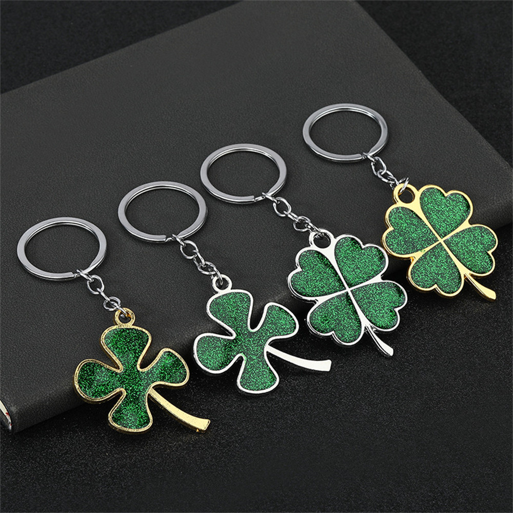 แฟชั่นสีเขียวfour-leaf Clover FortuneพวงกุญแจGlitterโชคดีแหวนผู้หญิงผู้ชายกระเป๋าเป้สะพายหลังเครื่องประดับDIYของขวัญ
