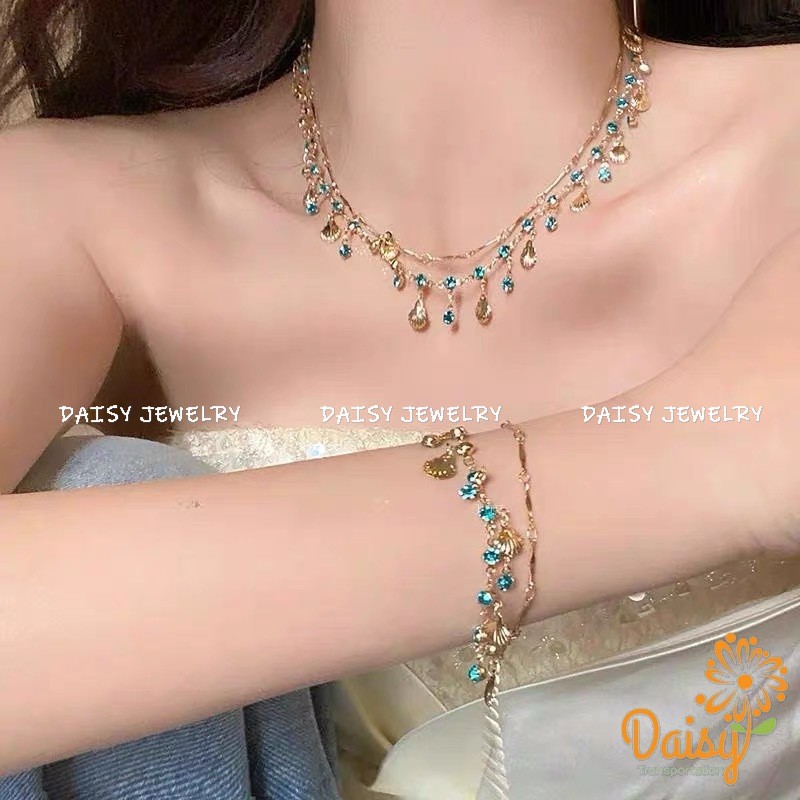เดซี่<ลูกสาวทะเล~ สร้อยคอเปลือกหอยทองเพทายสีฟ้าพร้อมสร้อยข้อมือเครื่องประดับหรูหราเบาๆ