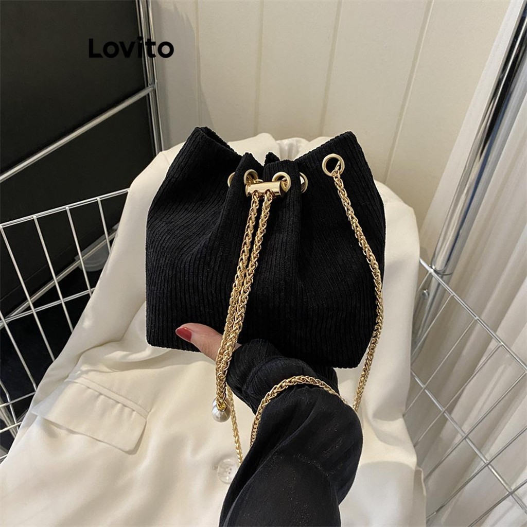 Lovito สายคล้องไหล่หนังกลับสีขาวสีน้ำตาลขนาดเล็กสำหรับผู้หญิงสบาย ๆ ถังธรรมดากระเป๋า Pullout มุกสายคล้องไหล่หนังนิ่มสีขาวสีดำสีน้ำตาลกระเป๋าสะพายขนาดเล็กสำหรับผู้หญิง LFA52106