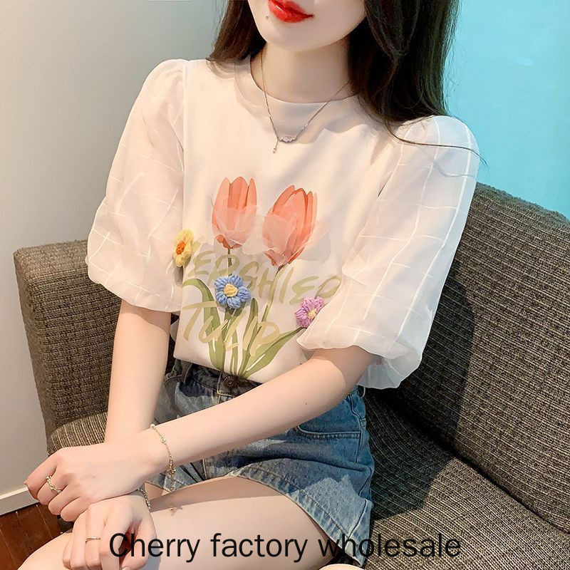 แฟชั่นผู้หญิงสไตล์ใหม่สีขาวพัฟแขนผ้าฝ้ายแท้แขนสั้นเสื้อยืดสามมิติดอกไม้อายุ @