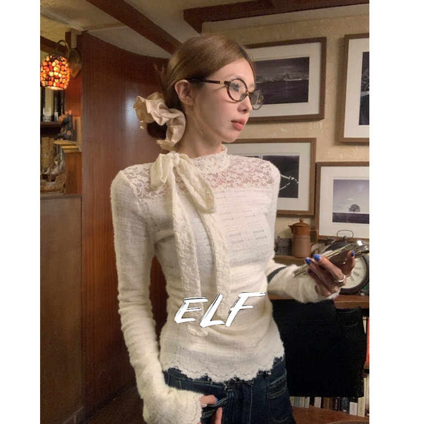สไตล์ฝรั่งเศสเย็บปะติดปะต่อกันออกแบบผีเสื้อโบว์ริบบิ้นลูกไม้แขนยาวเสื้อยืดสําหรับผู้หญิง