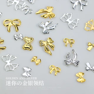50 ชิ้น เครื่องประดับเล็บโบว์โลหะผสมคนดังทางอินเทอร์เน็ตสีทองสีเงินหรูหราเบาๆผูกโบว์กลวงริบบิ้นตกแต่งเล็บขายส่ง
