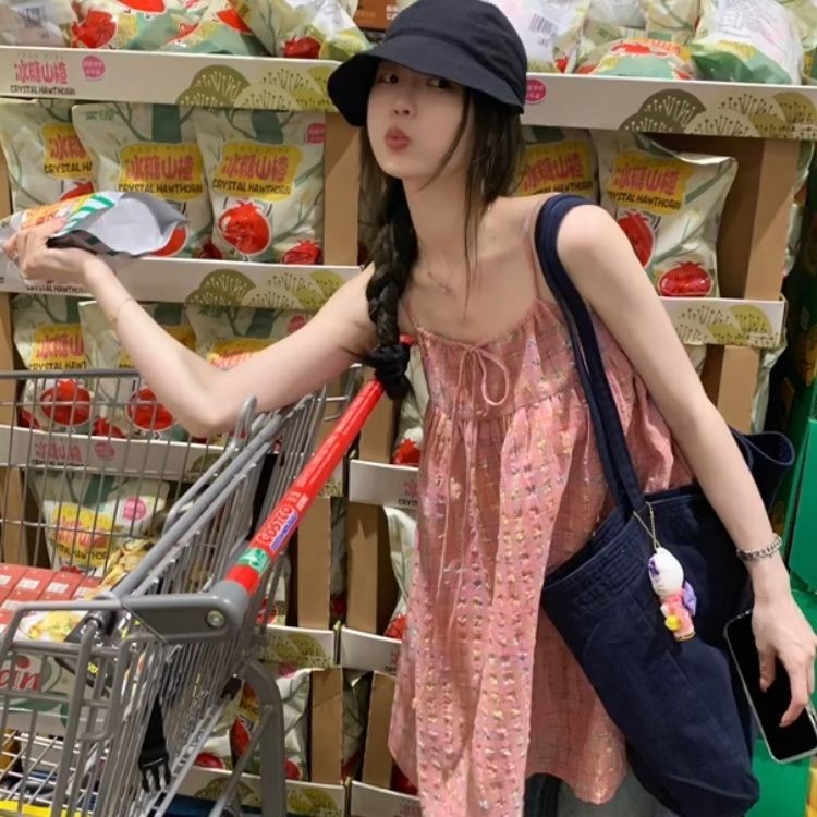 ผู้หญิงสีชมพูโบว์แขนกุดหลวมเสื้อแขวนหวาน