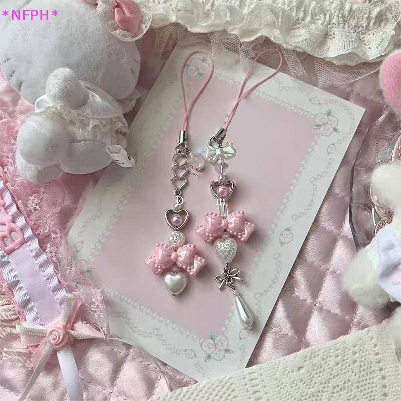 NFPH> ย2เค สีชมพูกุทัณฑ์หัวใจลูกปัดพวงกุญแจหวานน่ารักเชือกเส้นเล็กโทรศัพท์มือถือสดทุกการแข่งขันกระเป๋าจี้กระเป๋าตกแต่งใ