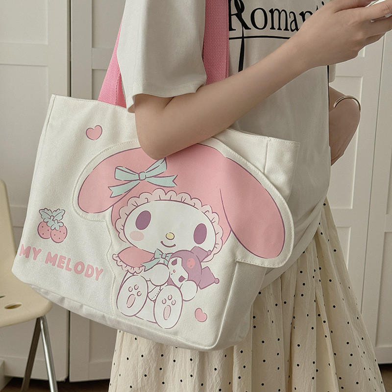 ฤดูร้อนรูปแบบใหม่ Sanrio ผ้าใบกระเป๋านักเรียน Commuting กระเป๋ากวดวิชา Cross Body กระเป๋าสะพาย 3D รูปแบบกลางแจ้งสาวช้อปปิ้ง