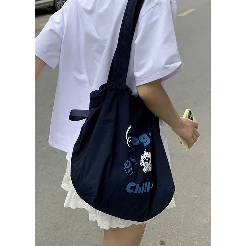 กระเป๋าผ้าใบหูรูดสไตล์ขี้เกียจหญิงสไตล์ใหม่อินเทรนด์เกาหลี สิริ กระเป๋านักเรียนชั้นกระเป๋าช้อปปิ้งความจุขนาดใหญ่