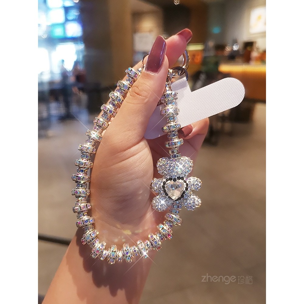 [พีดีเอ็ม] พลอยเทียม ระดับไฮเอนด์แขวนโซ่แฟชั่นเทพธิดาโทรศัพท์มือถือเชือกเส้นเล็กสไตล์สั้นข้อมือกระพริบจี้เพชรพร้อมเปลือกคลิปแข็งแรงกลางแจ้งป้องกันการสูญ