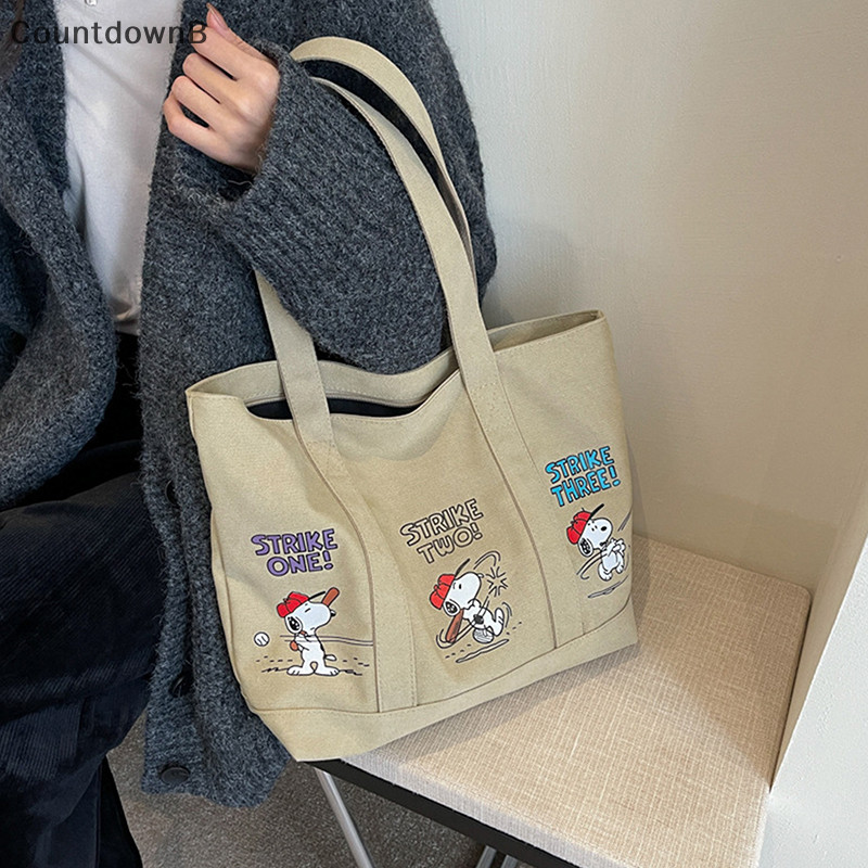 Co 1PC Snoopy ลายการ์ตูน Pring ผู้หญิงส่วนบุคคล Casual และอเนกประสงค์ขนาดใหญ่ความจุ One-shoulder กระเป๋าผ้าใบแบบพกพา A