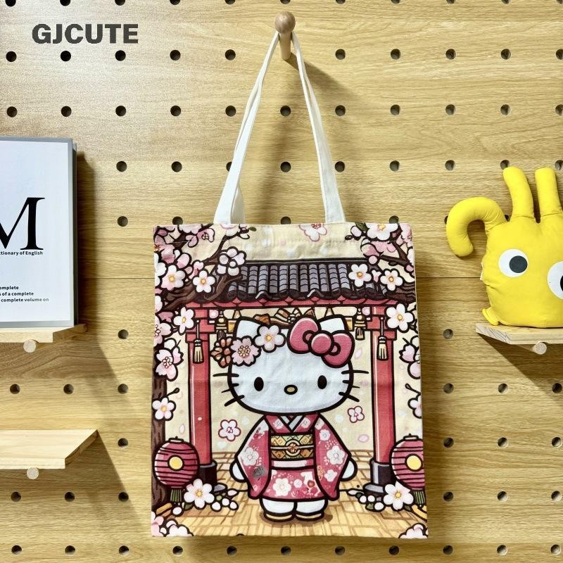 GJCUTE 2025 Hello Kitty กระเป๋าผ้าแคนวาสใหม่ Sakura Hello Kitty กระเป๋าสะพายนักเรียนความจุขนาดใหญ่กร