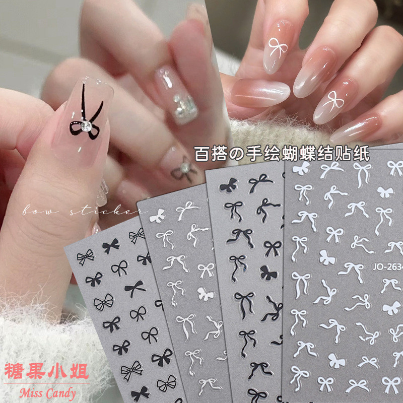 มือวาดโบว์เล็บสติ๊กเกอร์สีดําสีขาวทองเงินริบบิ้นโบว์สวมใส่เล็บสติ๊กเกอร์