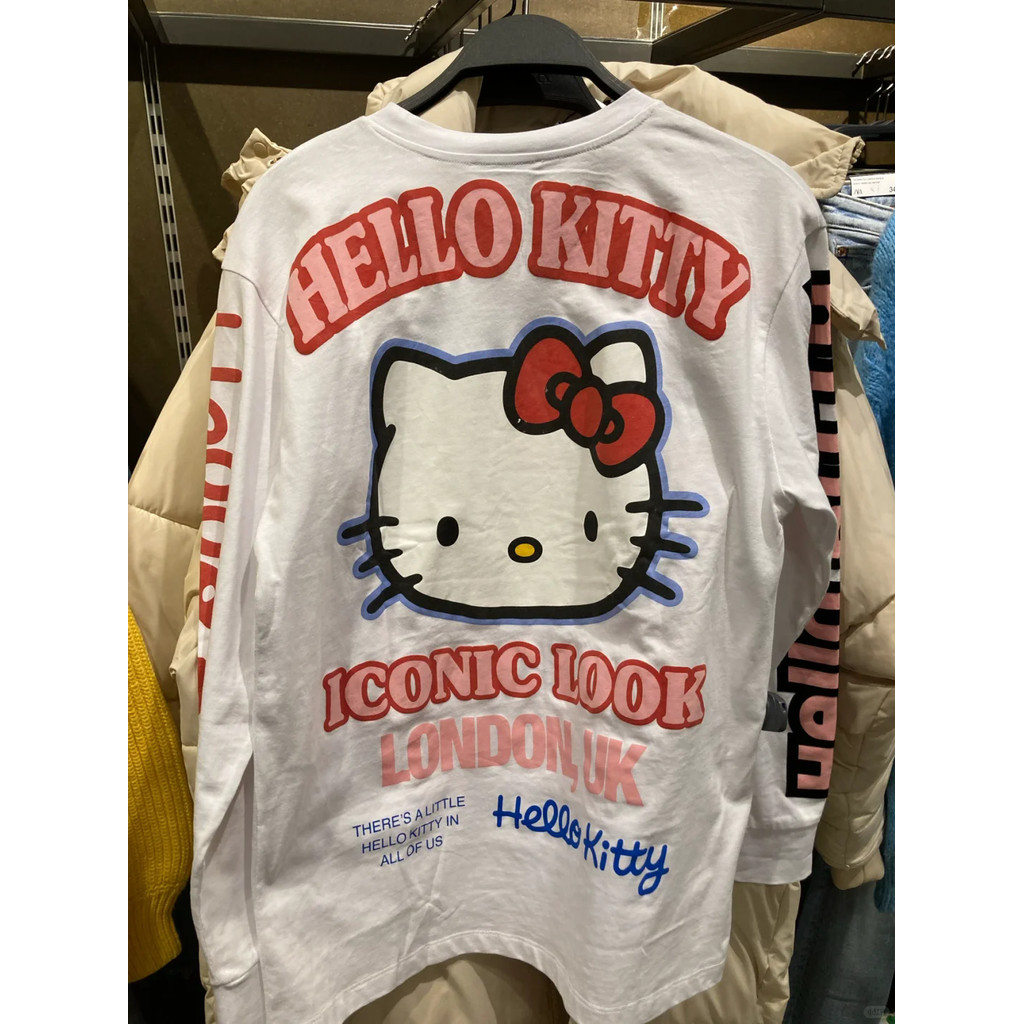 เสื้อยืดแขนยาวพิมพ์ลายตัวอักษรแมว KT สําหรับเทรนด์ยอดนิยมหลวมของผู้หญิง