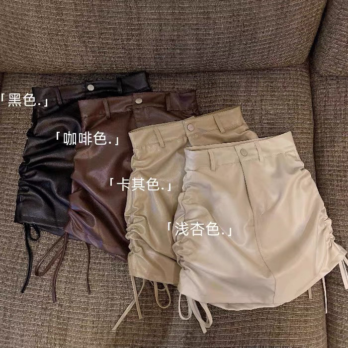 ราคาพิเศษ! F & X หนัง PU ผู้หญิงเอวสูงใส่แล้วดูผอมมีเชือกผูกจีบกระโปรงรัดสะโพก2022กระโปรงสายรัดสีดำแบบใหม่ฤดูร้อน