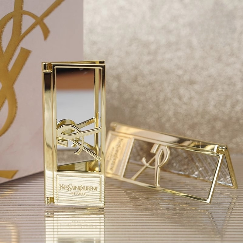 SG SELLER High-End Feeling YSL Saint Laurent เคาน์เตอร์ของขวัญโลหะ Hollow พับแบบพกพาแต่งหน้ากระจกแม่