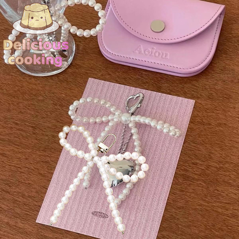 [ทําอาหารแสนอร่อย] Pearl Bowknot Charm พวงกุญแจหวานน่ารักจี้แขวนเครื่องประดับพวงกุญแจกระเป๋าเป้สะพายหลังตกแต่งเครื่องประดับสําหรับผู้หญิงสาว [ใหม่]