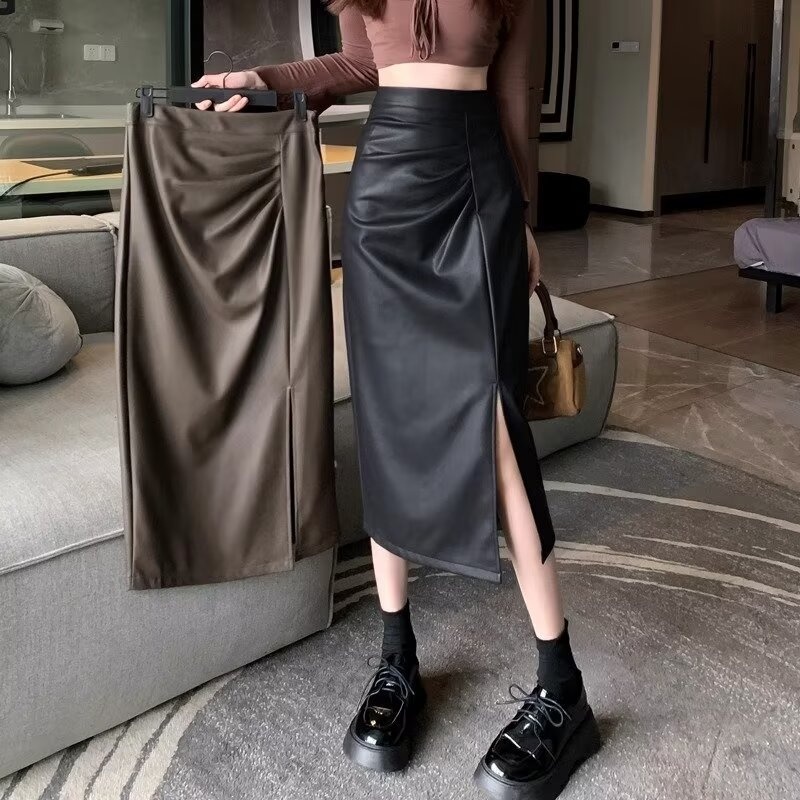 ออกแบบความรู้สึก Classy แยกกระโปรงหนังผู้หญิง 2025 ฤดูใบไม้ร่วงสไตล์ใหม่ Retro Niche เอวสูง Slimmer ดูกระโปรงยาวปานกลาง