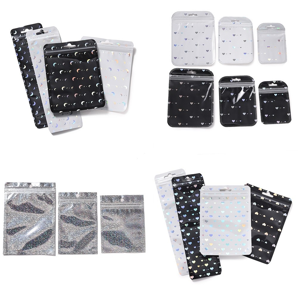 St.kunkka 50Pcs โฮโลแกรมถุงพลาสติกใสดวงจันทร์ลายหัวใจสีดําสีขาวปิดผนึกกระเป๋าเลเซอร์สไตล์กระเป๋ามัลติฟังก์ชั่ ทําเอง บรรจุภัณฑ์จัดเก็บสร้อยข้อมือสร้อยคอแหวน
