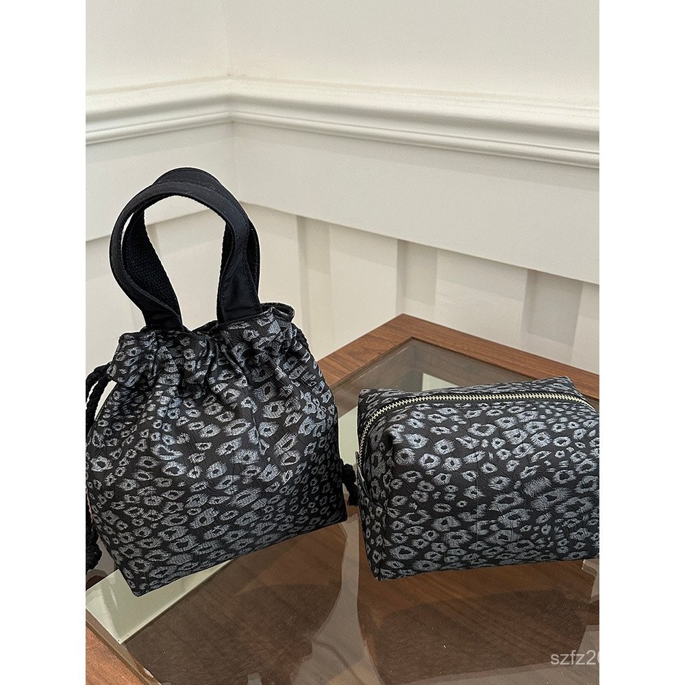 ที่เก็บของ 2025สามารถถือขนาดเล็กเดิมแบบพกพาแบบพกพาไล่น้ําถุงเล็กโทรศัพท์มือถือเนื้อกระเป๋าเครื่องสํา