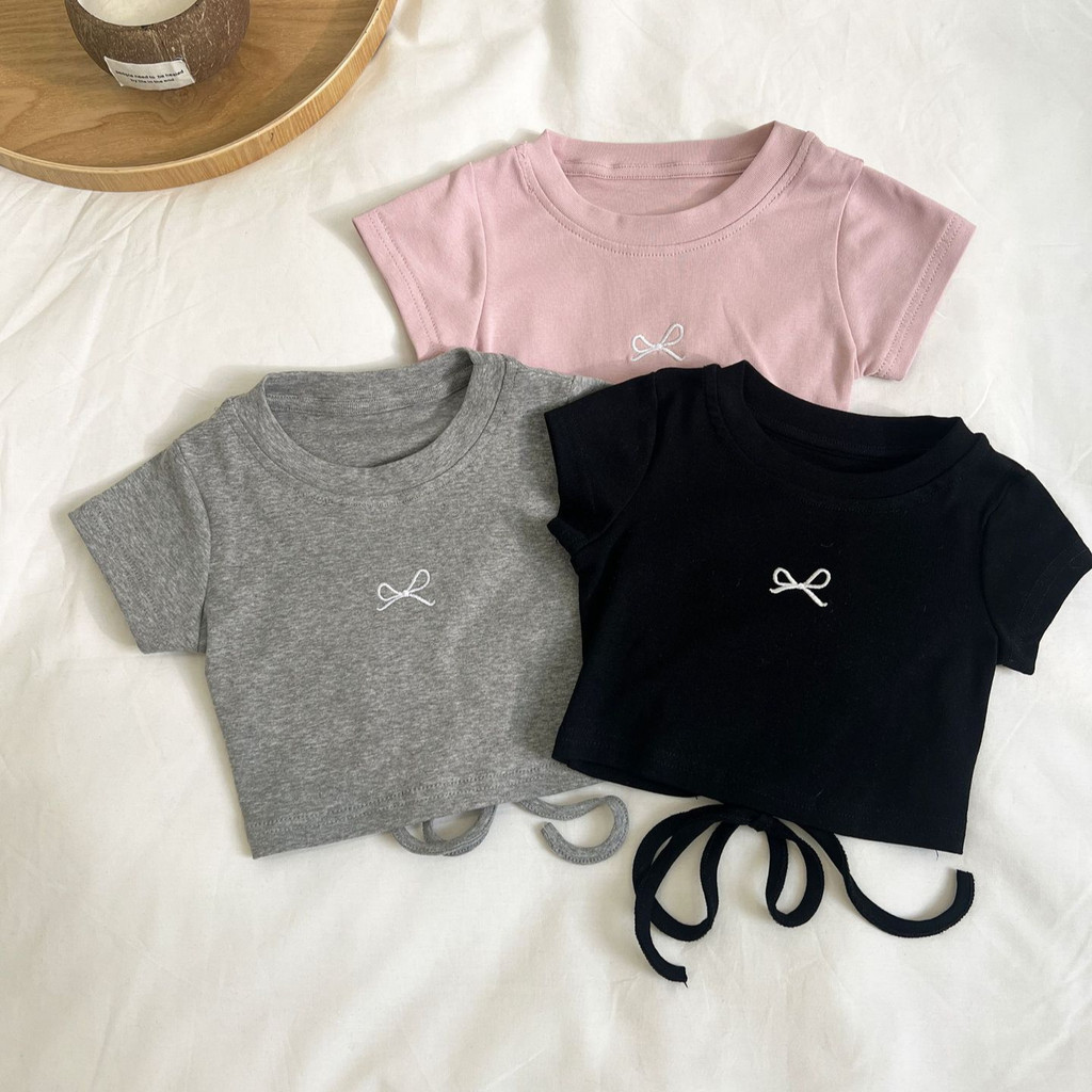 สาวเสื้อยืดฤดูร้อนเด็กโบว์ปักเชือกแขวนคอแขนสั้นเด็กน่ารักสบายๆด้านบนสาวเกาหลีเสื้อผ้า
