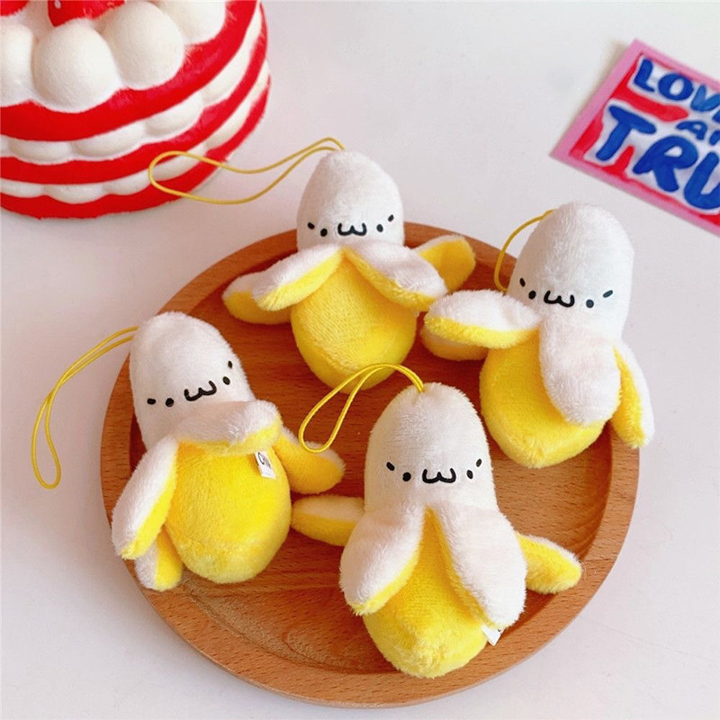​น่ารักตุ๊กตาปอกเปลือกกล้วยพวงกุญแจน่ารักของเล่นตุ๊กตา พนันท ผู้หญิงสาวกระเป๋าถือกระเป๋าเป้สะพายหลังเครื่องประดับการ์ตูนผลไม้พวงกุญแจ