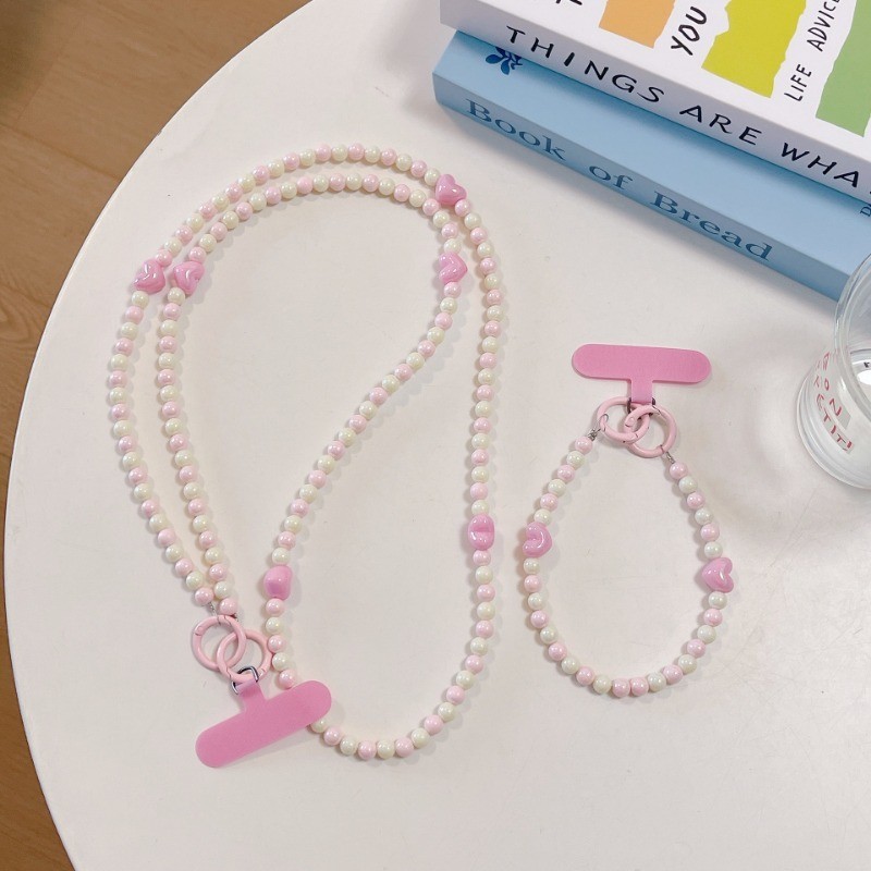 เกี่ยวกับ สีสีชมพูรักรูปหัวใจลูกปัด ค โรสบอดี โทรศัพท์โซ่หญิงแข็งแรงหัวเข็มขัดคู่ยาวเชือกเส้นเล็กที่ถอดออกได้