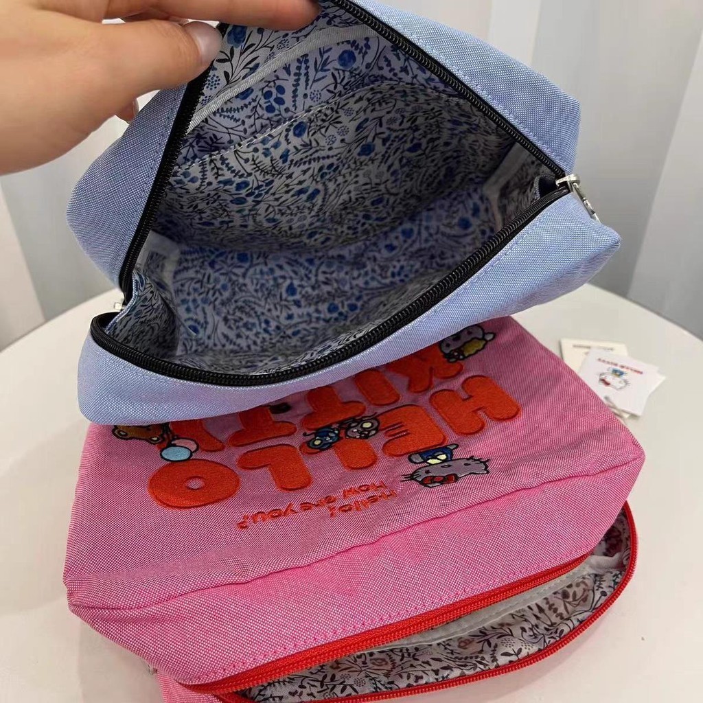 LeSportsac  เลสปอร์ตแซค สไตล์ใหม่ คิตตี้ การ์ตูนปักกระเป๋าหญิง/กระเป๋าเก็บแต่งหน้ากระเป๋าคลัทช์ 7121