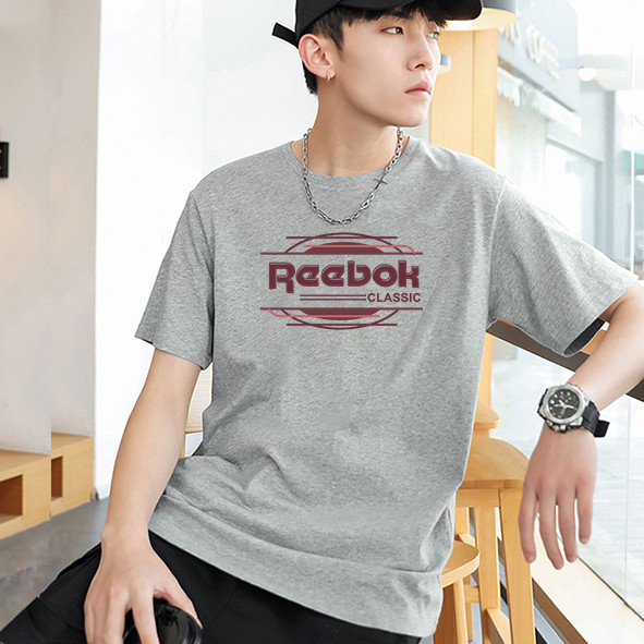 Reebok Classic CL F VECTOR TEE เสื้อยืดแขนสั้นพื้นฐานสําหรับผู้ชายและผู้หญิง Sharp เสื้อยืดกีฬา Step