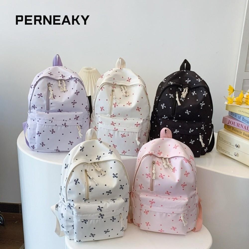 กระเป๋าเป้ PERNEAKY สำหรับนักเรียน สายปรับระดับได้ พิมพ์ลายโบว์ ขนาดใหญ่พิเศษ ทำจากไนลอน ออกแบบมาพร้อมช่องเก็บของมากมาย เหมาะสำหรับใช้งานทุกวัน