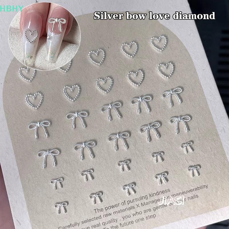HB 10pcs Alloy Bowknot Love Nails Art Charms ตกแต่ง 3D โลหะหรูหรา Silver Bows รูป Jewellery DIY เล็บออกแบบอุปกรณ์ HY