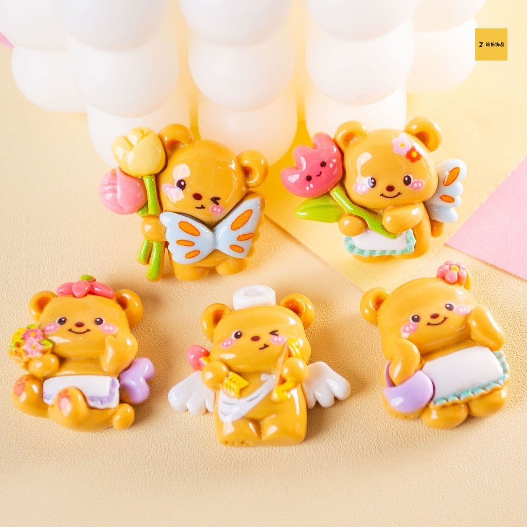 อุปกรณ์เรซินการ์ตูน DIY เครื่องประดับหมีถือดอกไม้เงากิ๊บติดผมแฮนด์เมดเคสโทรศัพท์สติกเกอร์ติดตู้เย็นเครื่องประดับผมขายส่ง