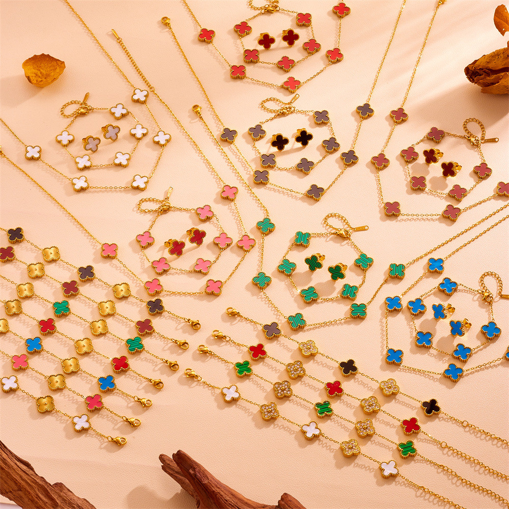 Lucky ดอกไม้สี่แฉกเหล็กไทเทเนียมไม่ซีดจางสร้อยข้อมือสแตนเลสโคลเวอร์สี่ใบสร้อยคอสองด้านพร้อมสร้อยข้อมือเพชรต่างหูสตั๊ดขายส่ง