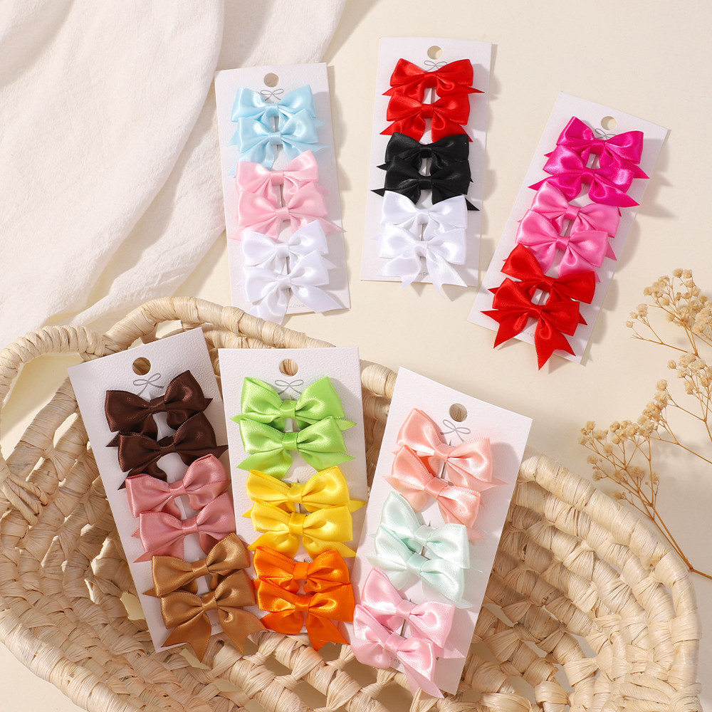 6ชิ้น/เซ็ตน่ารักลูกอมสีโบว์กิ๊บเด็กสาวปีใหม่บัตรผมพรรคอุปกรณ์ผมของขวัญ
