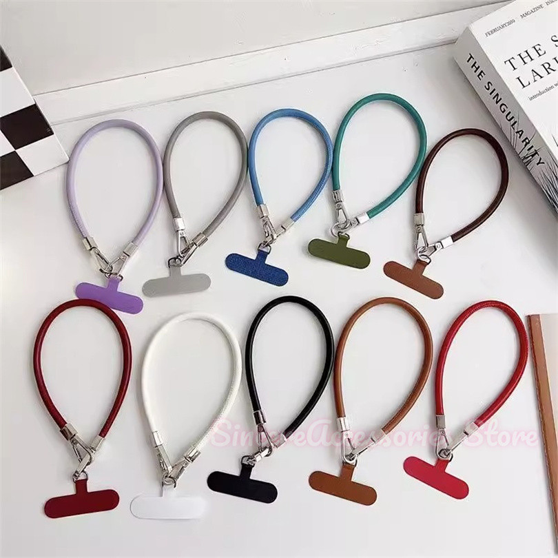 สายคล้องโทรศัพท์หนัง แฟชั่นและทนทานสายหนังระดับไฮเอนด์ป้องกันการตกหัวเข็มขัดคู่ข้อมือจี้โซ่แขวนแข็งแรง