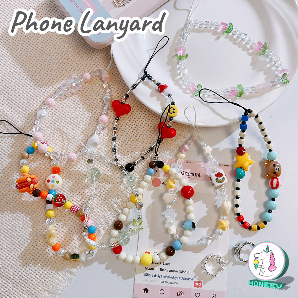 เกาหลีลูกปัดสีโทรศัพท์โซ่สั้นเสน่ห์ป้องกันการสูญหายสายรัดข้อมือ คําศัพท์ โทรศัพท์มือถือเชือกเส้นเล็กสาวพวงกุญแจกรณีโทรศัพท์มือถือแขวนโซ่อุป
