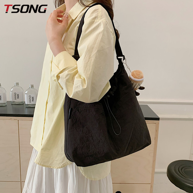 TSONG ความจุขนาดใหญ่ เชือกรูด ถังกระเป๋าหญิง 2025 สไตล์ใหม่ญี่ปุ่นแฟชั่นสบายๆกระเป๋า ผู้สื่อสาร ถนน 