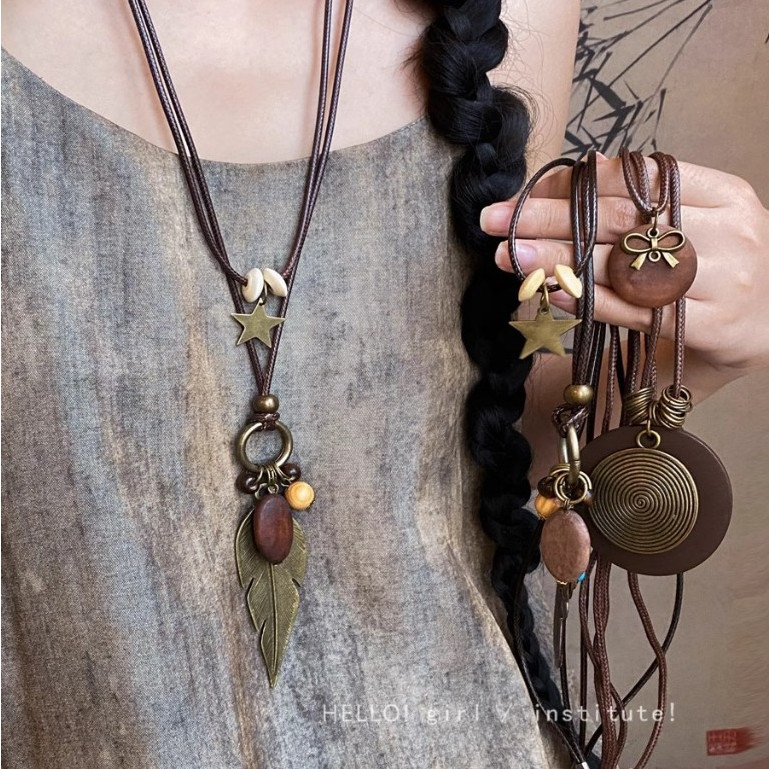 [จูวบิวตี้]ใหม่จีนเซนสร้อยคอขนนกสีบรอนซ์ผู้หญิงโบฮีเมียนสไตล์ชาติพันธุ์สองชั้นสวมใส่โซ่เสื้อกันหนาวยาวอุปกรณ์เสริม