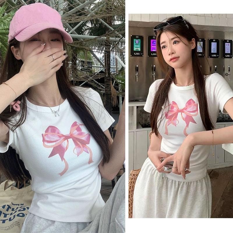 หวานน่ารักเสื้อยืดสีชมพูโบว์แขนสั้นพิมพ์บางเสื้อสำหรับผู้หญิงฤดูร้อน แฟชั่นเก๋ไก๋เสื้อยืด