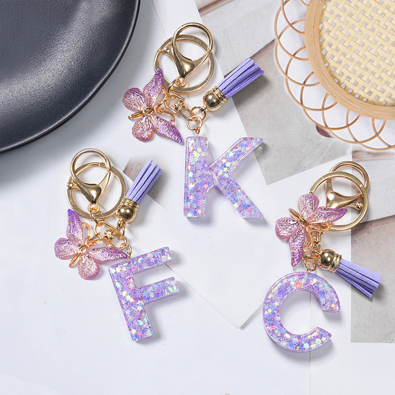 1ชิ้นสีม่วงพู่ผีเสื้อ26จดหมายพวงกุญแจดาวเลื่อมเรซิ่นเริ่มต้นจี้พวงกุญแจกระเป๋าเครื่องประดับ