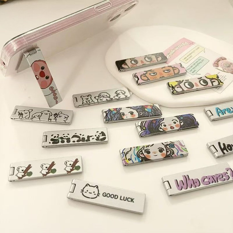 🔥GOOD🔥การ์ตูนน่ารักตัวอักษรสร้างสรรค์โลหะที่วางโทรศัพท์ยืดจับแหวนโทรศัพท์ สามารถวางได้