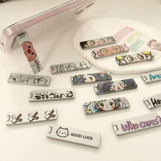 🔥SUN🔥 การ์ตูนน่ารักตัวอักษรสร้างสรรค์โลหะที่วางโทรศัพท์ยืดจั…