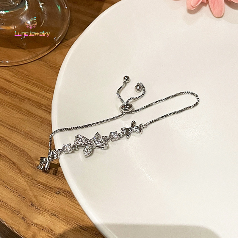 COD💖สร้อยข้อมือ Lux Zircon Bow ระดับพรีเมี่ยมสำหรับสุภาพสตรีอุปกรณ์เสริมที่ละเอียดอ่อน-Lune