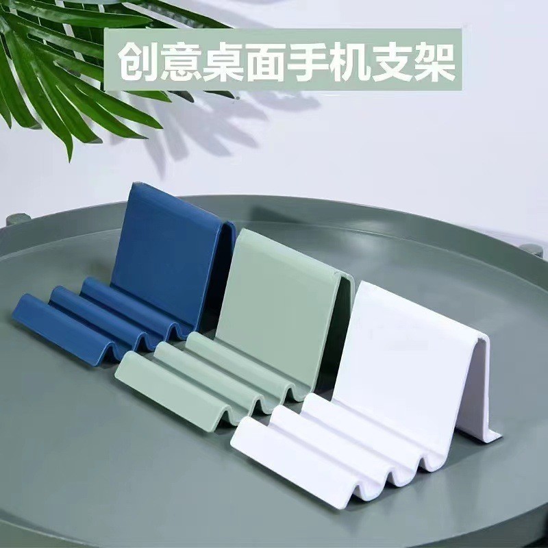 นอร์ดิกที่เรียบง่ายแบบพกพาคลื่นคลื่นหอพักสก์ท็อปโทรศัพท์ยืนหลายมุมสก์ท็อปยืนแท็บเล็ตโทรศัพท์สากล