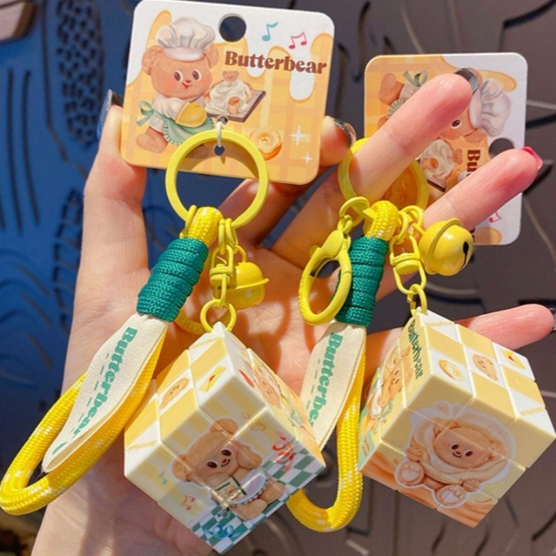 Butter Bear Rubik's Cube พวงกุญแจน่ารักระดับสามการบีบอัดพวงกุญแจปริศนาแหวนกระเป๋าจี้กระเป๋า