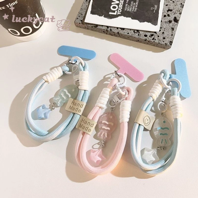 อิน หวานสีฟ้าสีชมพูคริสตัลปลาน้อยโทรศัพท์แหวนโทรศัพท์เชือกเส้นเล็กที่สําคัญเชือกเส้นเล็กป้องกันอุปกรณ์เสริมโทรศัพท